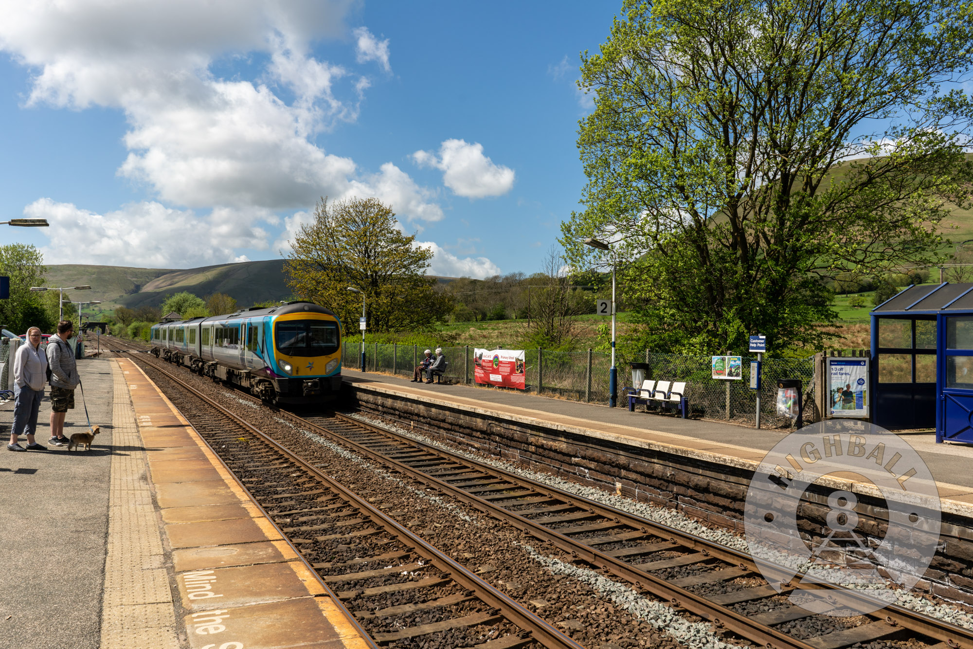 A train from the Trans-Pennine Express franchise at Edale Station in the Peak District, Derbyshire, England, UK, 2018.