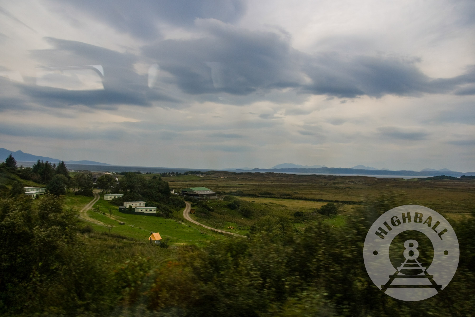 View of the Isle of Rhum from a Mallaig-bound West Highland Line train near Morar, Scotland, UK, 2010.